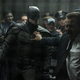 Gordon holding off cops from fighting batman.